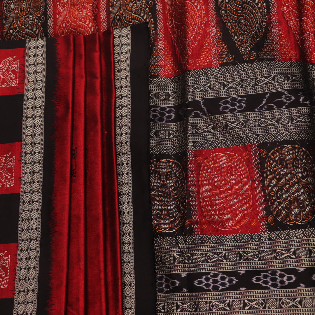 Detailed texture of handwoven Bomkai silk saree fabric in maroon and black with butta pattern.