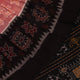 Full view of a peach-colored Sambalpuri cotton saree with black motifs.