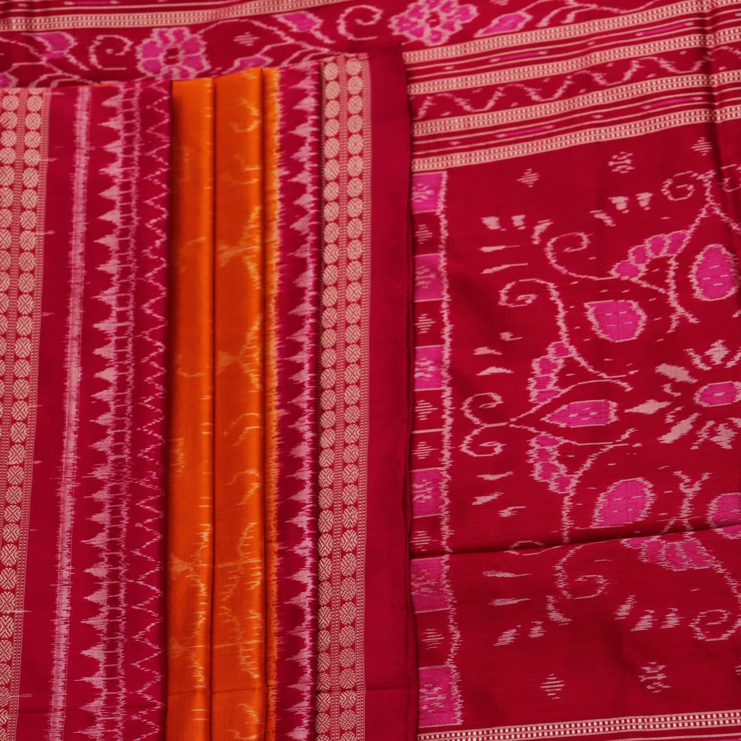 Close-up of intricate sambalpuri silk saree's yellow fabric featuring detailed motifs in rani color