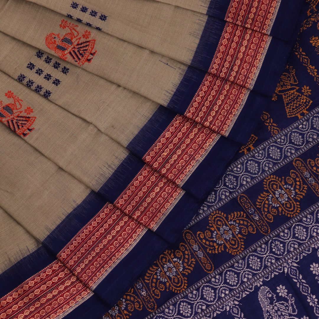 Full view of a handloom Bomkai saree in grey and blue with butta motifs.