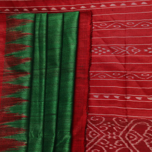 Close-up of green and red tussar silk saree fabric texture