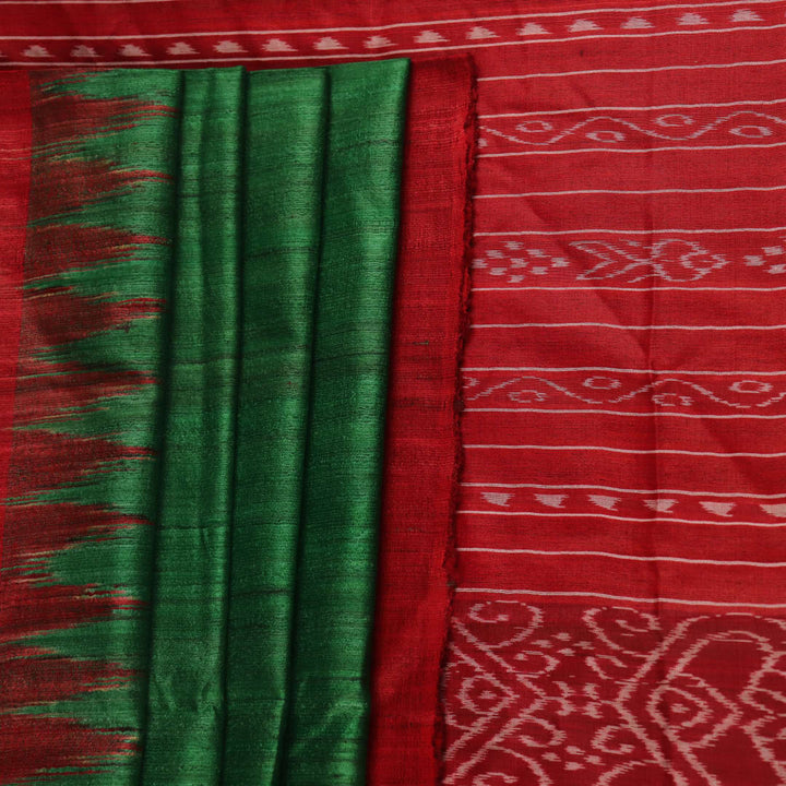 Close-up of green and red tussar silk saree fabric texture