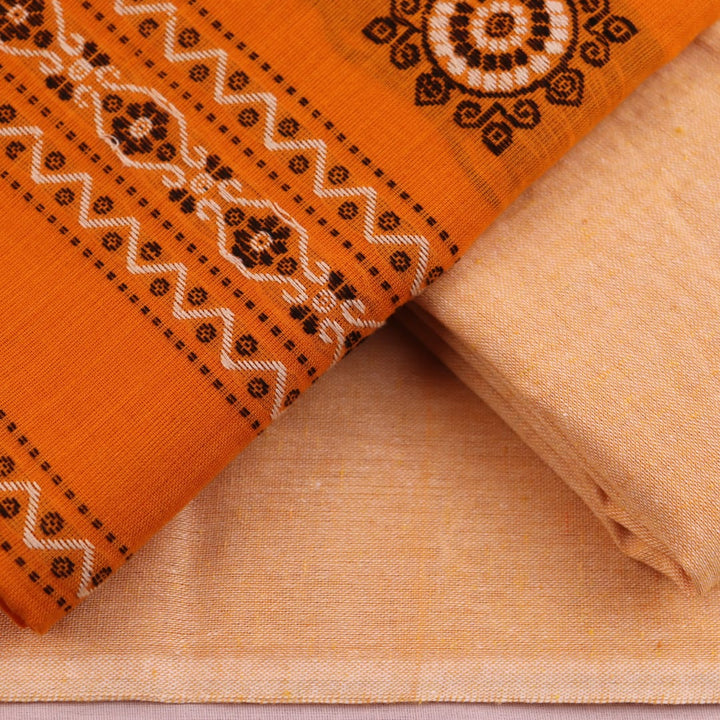 Detail of the coordinating blouse piece for the Bomkai cotton dress material in yellow and cream.