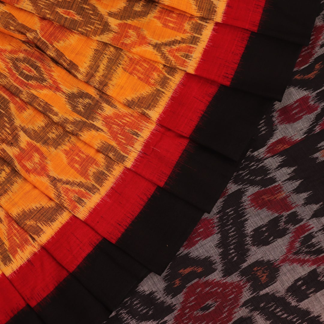 Yellow and black cotton Sambalpuri saree with motifs draped elegantly