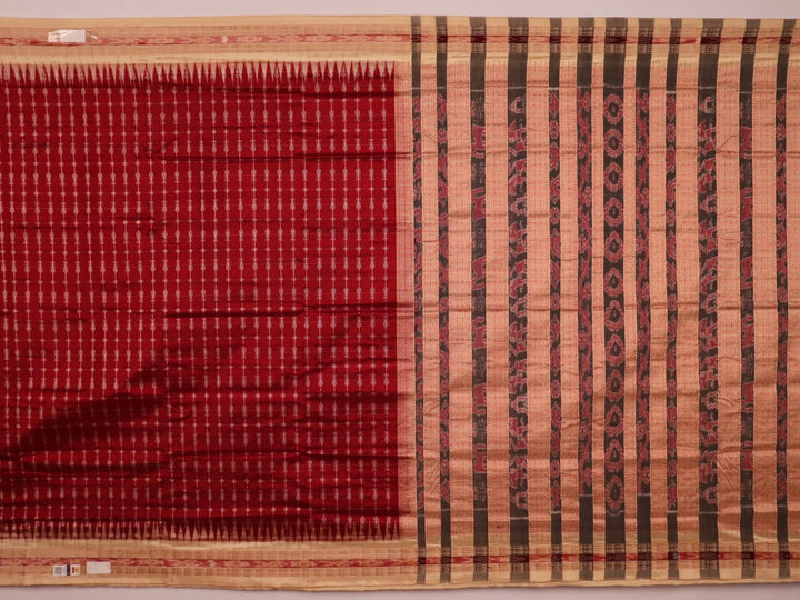 Close-up view of the richly textured silk fabric of a maroon and off-white Sambalpuri saree, featuring a delicate butta pattern.