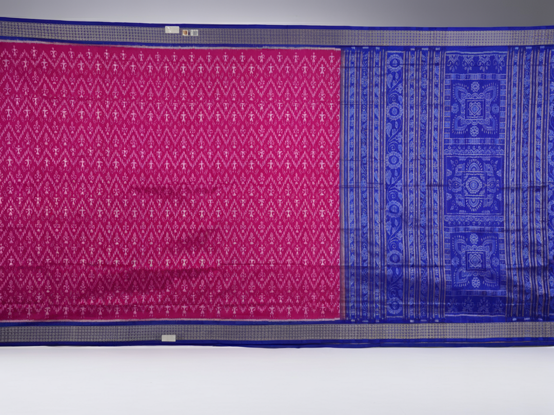 Close-up showing the luxurious handloom silk fabric texture and fine weave of the pink Sambalpuri saree.