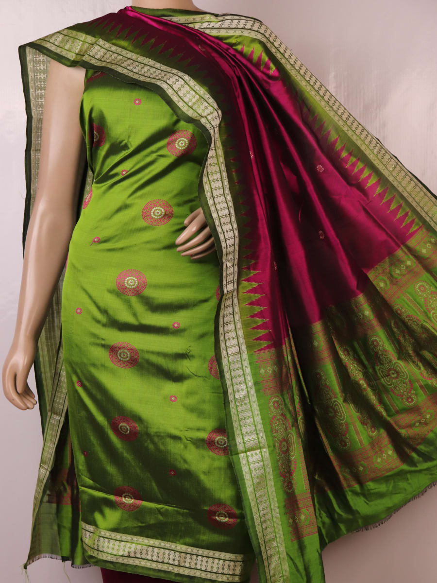 Green Bomkai silk dress material: Detail of magenta blouse piece with butta pattern.