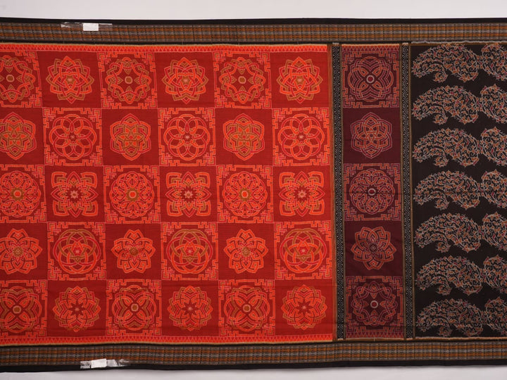 Full flat layout of the orange and black Sambalpuri cotton saree showing the body, border, and pallu