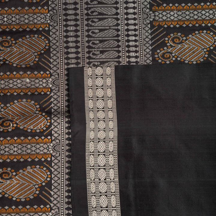 Extreme close-up of red Bomkai silk saree fabric showcasing rich texture and intricate weave.