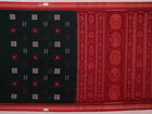 Full view of a green and red handloom Bomkai Cotton Saree with butta pattern.