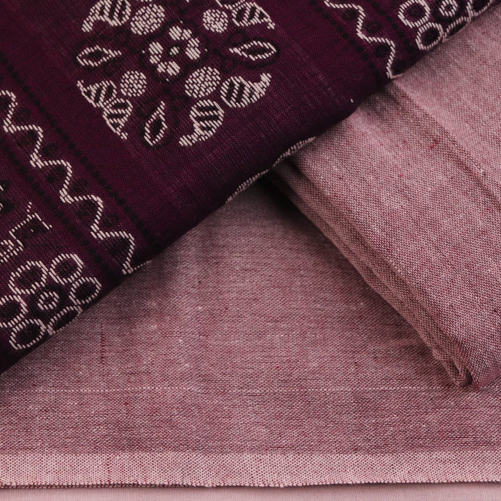 Close-up of Bomkai cotton dress material's matching blouse piece in brown with subtle purple details.