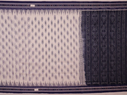 Model wearing a white Sambalpuri cotton saree with blue motifs, showcasing the drape and overall look.