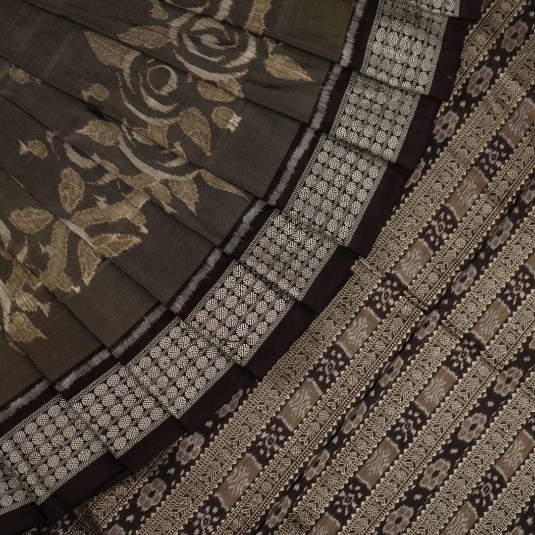Close-up of the grey and black Sambalpuri Silk Saree fabric, highlighting its rich silk texture and weave.
