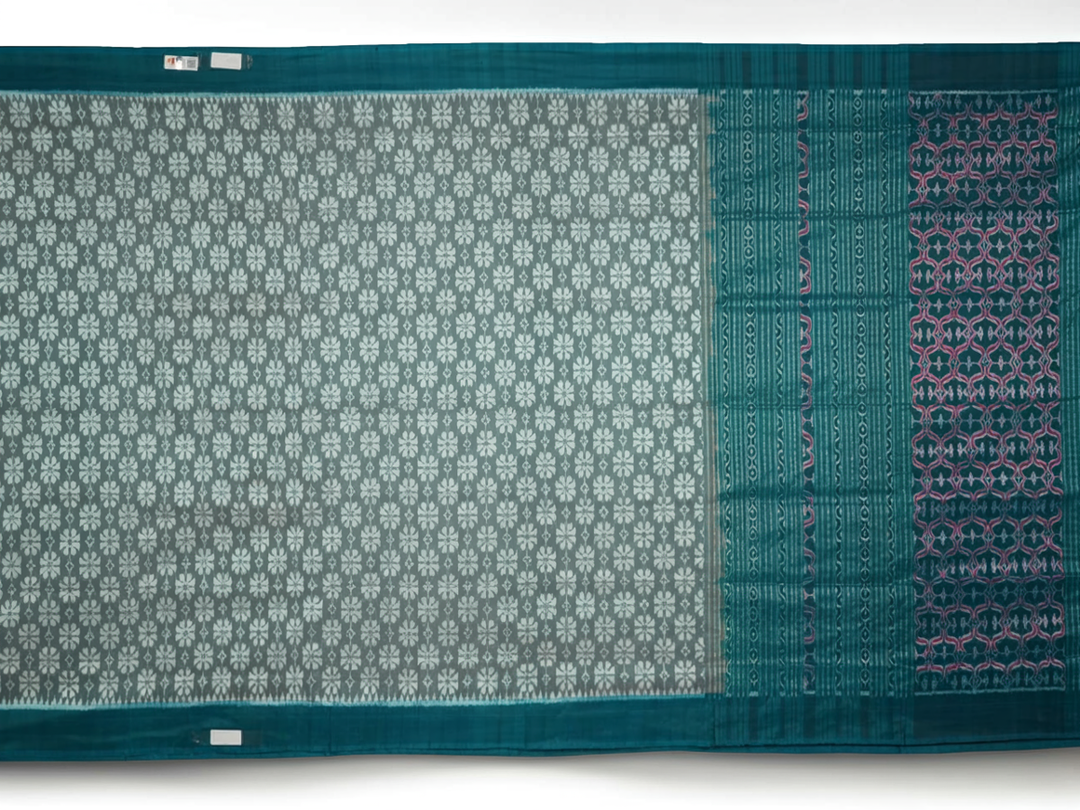 Close-up revealing the luxurious silk texture and subtle motif weave of the blue Sambalpuri saree.