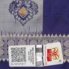Close-up of luxurious Bomkai Silk Saree fabric texture, highlighting grey and blue handloom weave.
