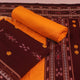 Detail of maroon & yellow Sambalpuri cotton dress material's motif-patterned blouse piece.