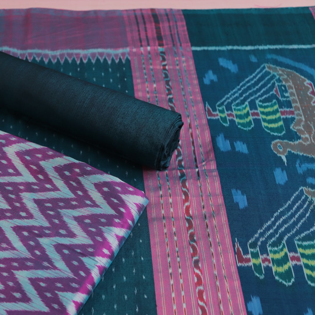 Sambalpuri silk dress material: Purple-green blouse piece with motif details.