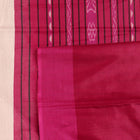 Close-up of plain white and black handloom Tussar Silk saree fabric texture.