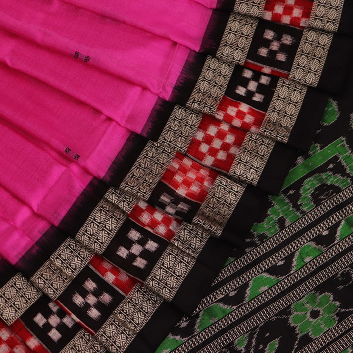 Close-up view of intricate Pasapalli pattern on a shimmering pink and black Sambalpuri silk saree