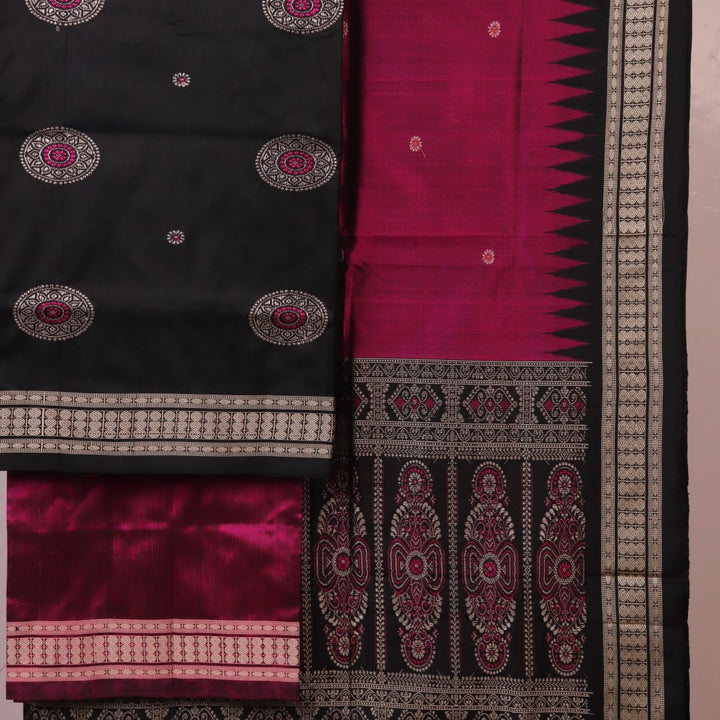 Close-up of Bomkai silk dress material blouse piece, black with magenta butta pattern.