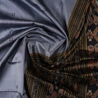 Full styling view of a model wearing a grey and black Khandua silk saree featuring elegant butta motifs.