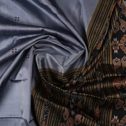Full styling view of a model wearing a grey and black Khandua silk saree featuring elegant butta motifs.
