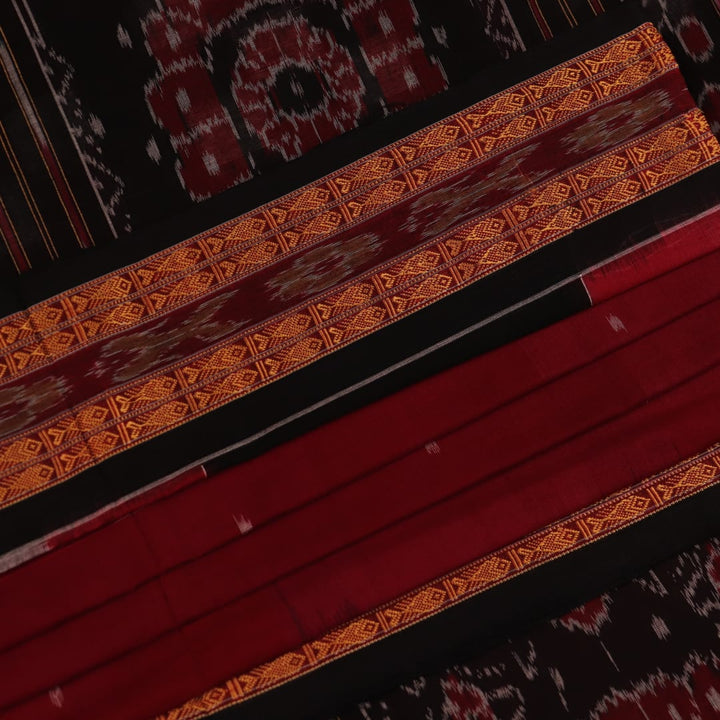 Full view of a maroon Sambalpuri cotton saree with a black Pasapalli pattern.