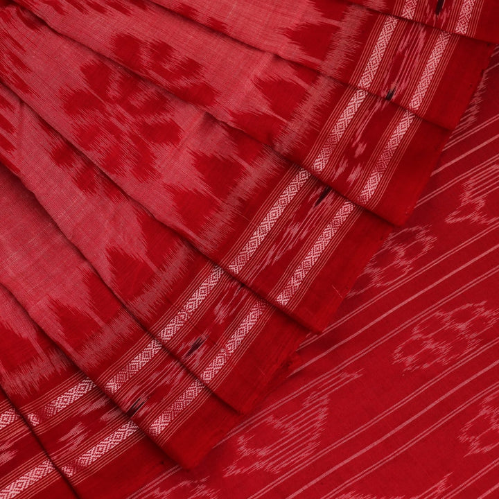 Red and green cotton Sambalpuri saree with traditional motifs draped on a model