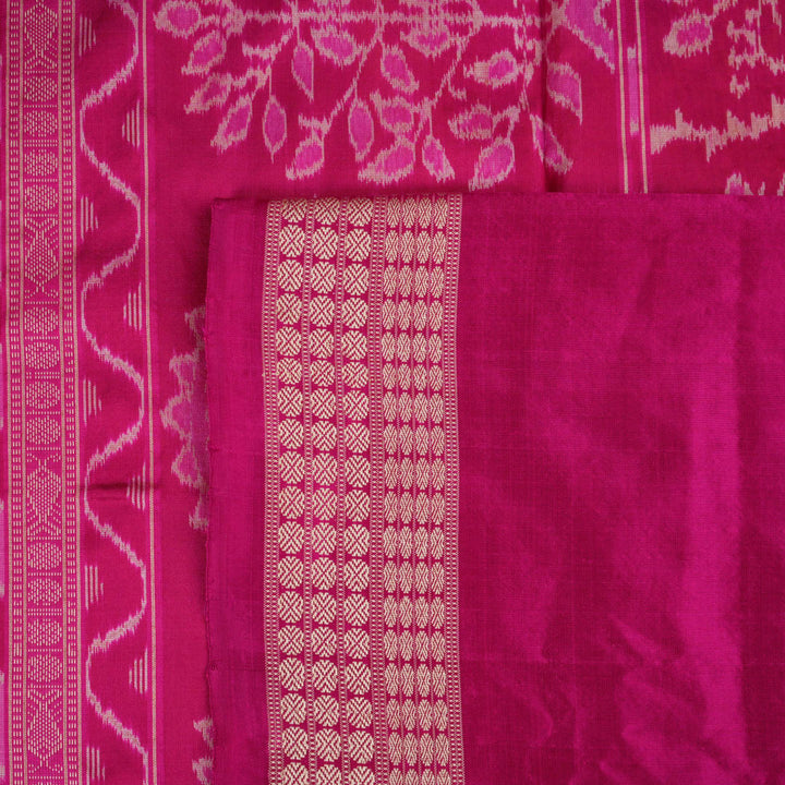 Close-up of the Bomkai Silk Saree's yellow fabric, revealing its luxurious texture and handloom weave.