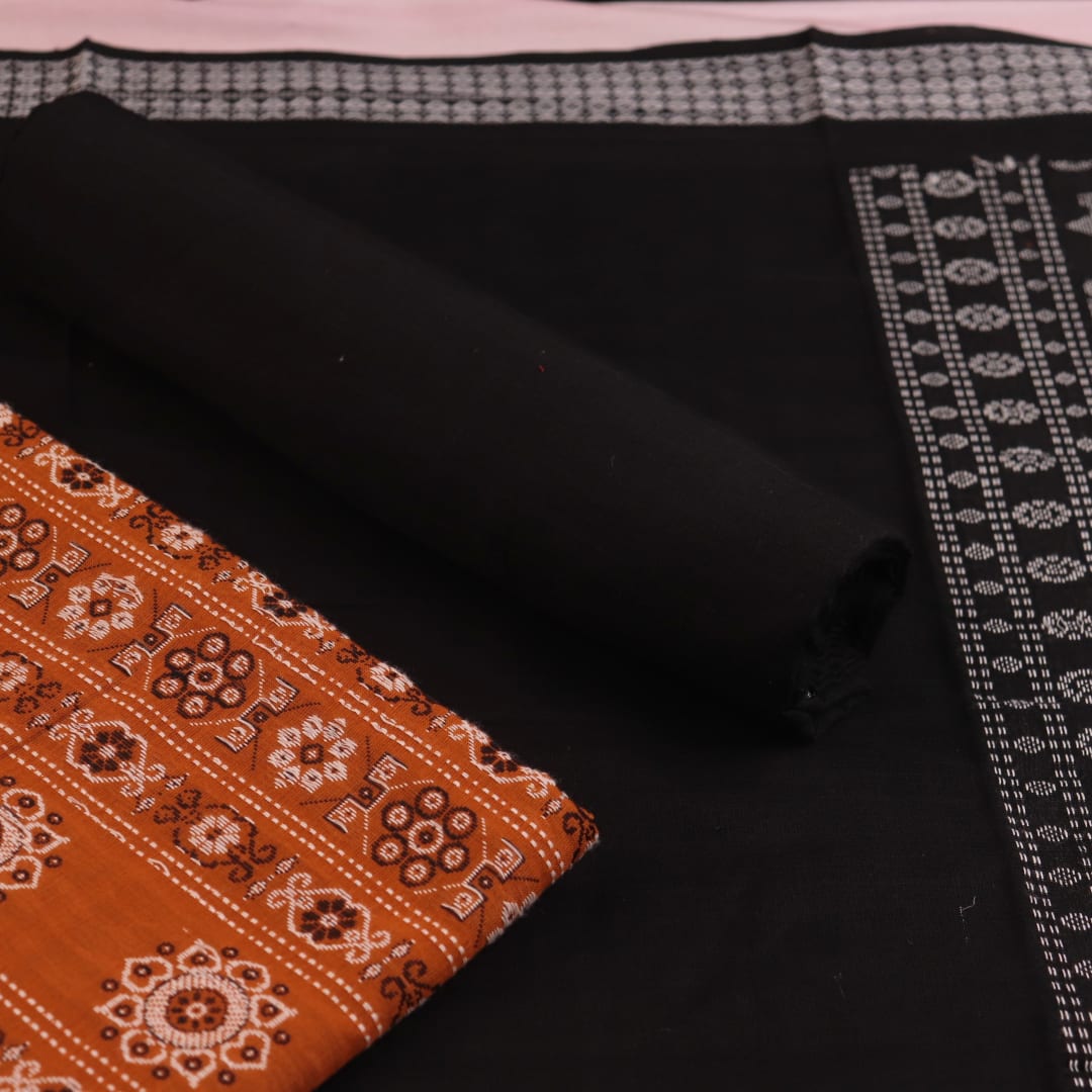 Detailed view of the black Bomkai cotton blouse piece, matching the yellow dress material.