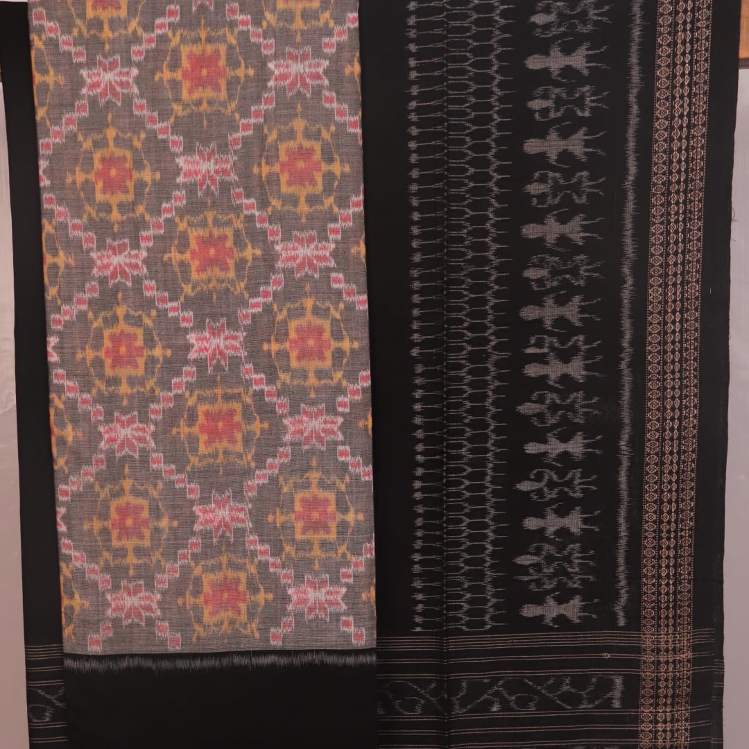 Close-up of Sambalpuri cotton dress material blouse piece in grey and black with motifs.