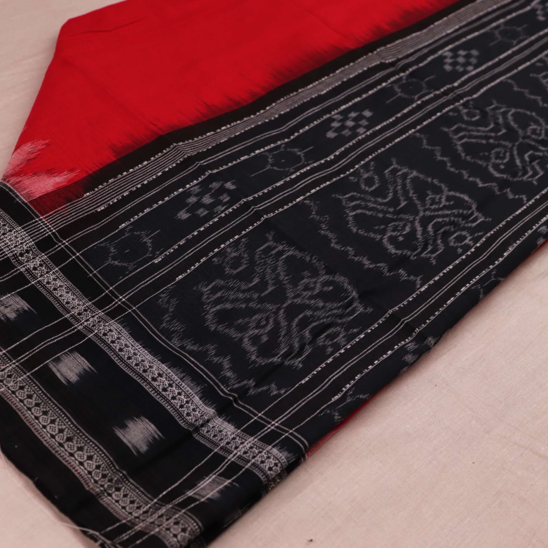 Styling view of a red cotton Sambalpuri dupatta with black plain pattern