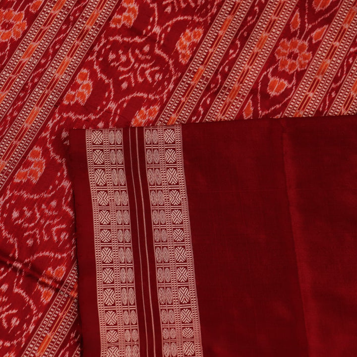 Close-up showcasing the fine texture of the silk material used in the Sambalpuri saree.