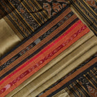Full styling view of a model draped in a brown and black Khandua silk saree from Odisha