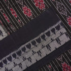 Model styled in a grey and black Sambalpuri cotton saree showing the elegant drape and traditional motifs.