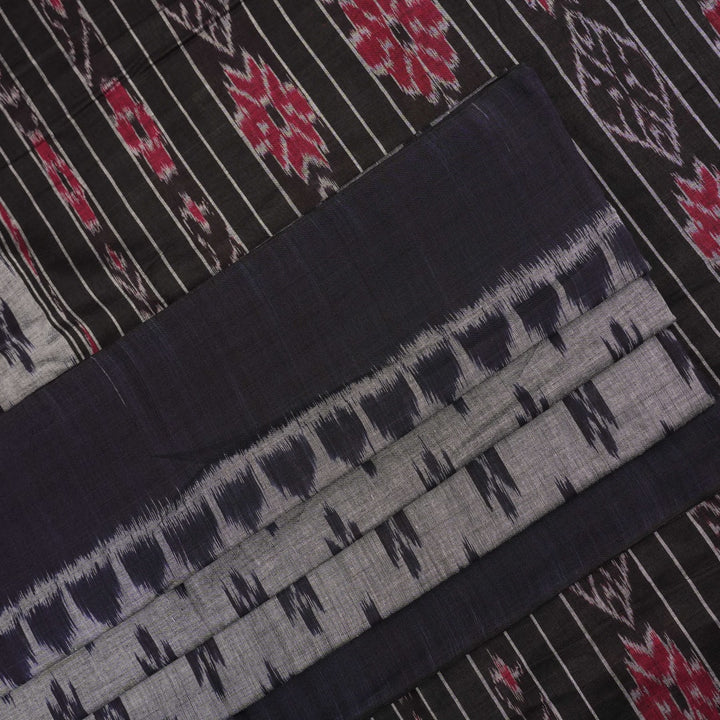 Model styled in a grey and black Sambalpuri cotton saree showing the elegant drape and traditional motifs.