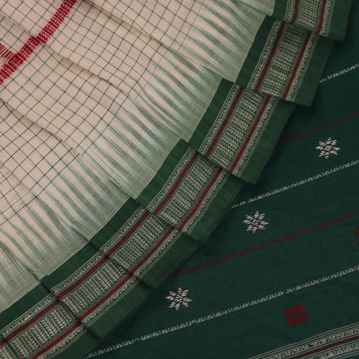 Full view of a white cotton Sambalpuri saree with green butta patterns.