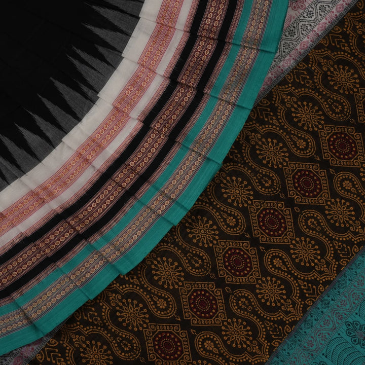 Full view of the black and green Bomkai cotton handloom saree showing the complete body, pallu, and border.