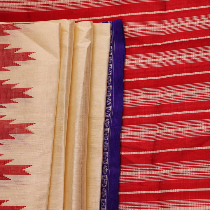 Close-up view of the intricate silk texture on a Berhampuri saree in white with a red border