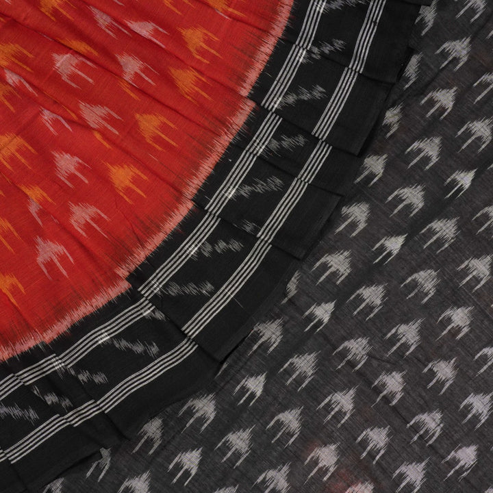 Model wearing a rust and black Sambalpuri cotton saree styled with traditional Odisha handloom motifs.