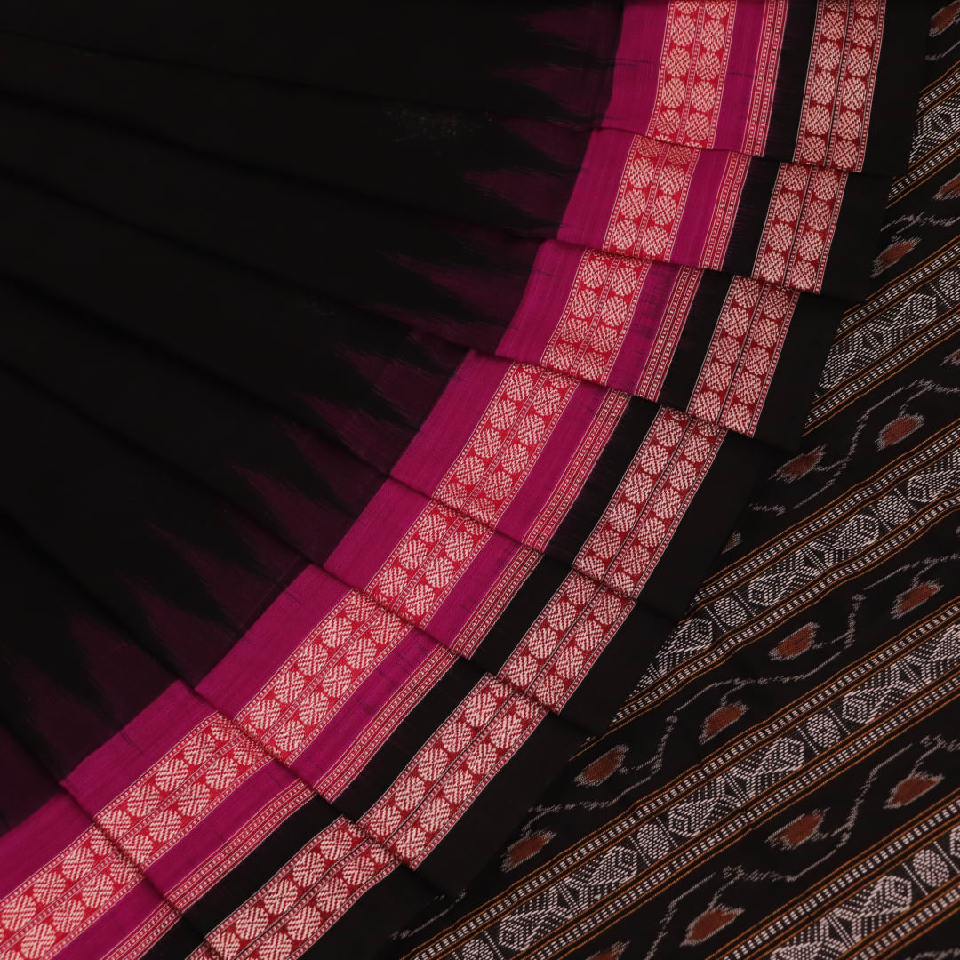 Full view of a magenta and black Bomkai cotton saree with intricate butta patterns.