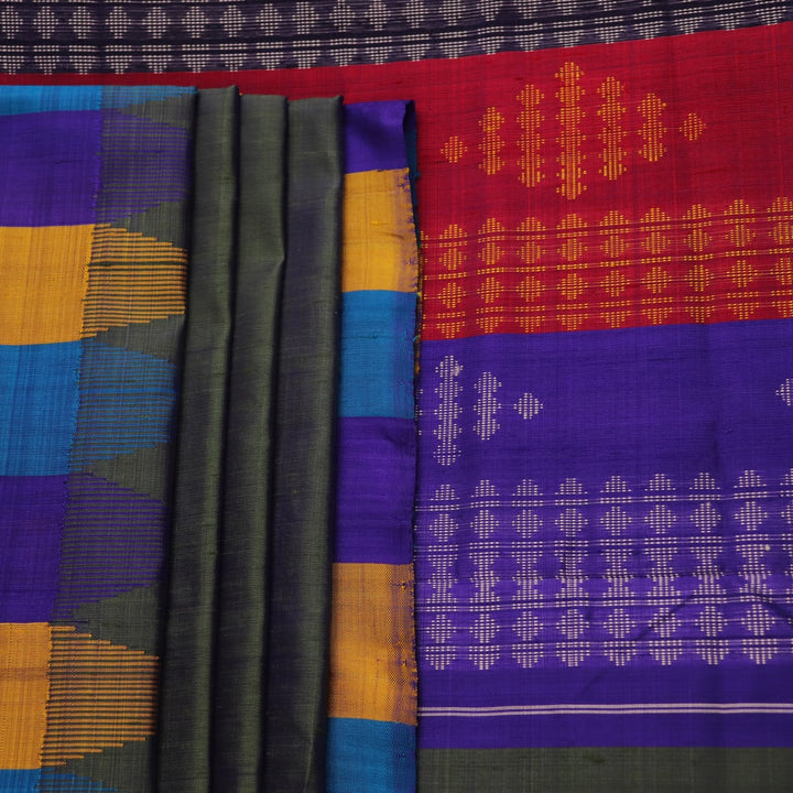 Close-up of the green silk fabric with a butta pattern in the Berhampuri saree