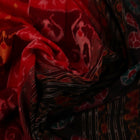 Full view of maroon and black cotton Sambalpuri saree showcasing intricate motifs on the body and border.