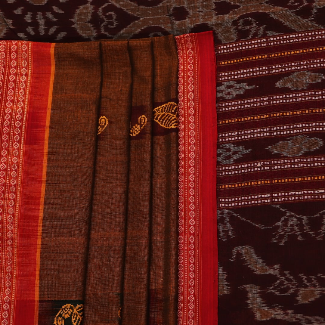 A brown and red Bomkai cotton saree with butta pattern on display