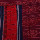 Red and blue Sambalpuri cotton saree draped to show styling and overall look.