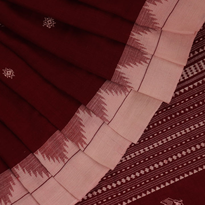 Full view of a maroon and off-white cotton Kotpad saree adorned with a traditional butta pattern.