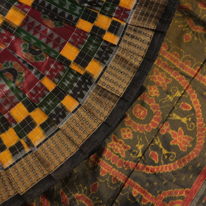 Extreme close-up of Sambalpuri Silk Saree fabric, revealing multi-color brown weave and tissue texture.