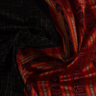 Close-up of black and red striped Sambalpuri silk saree's woven texture.