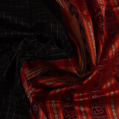 Close-up of black and red striped Sambalpuri silk saree's woven texture.