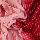 White and red cotton Sambalpuri Saree with motifs, elegantly draped.